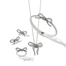 Load image into Gallery viewer, Illumina Bow Hinged Bangle
